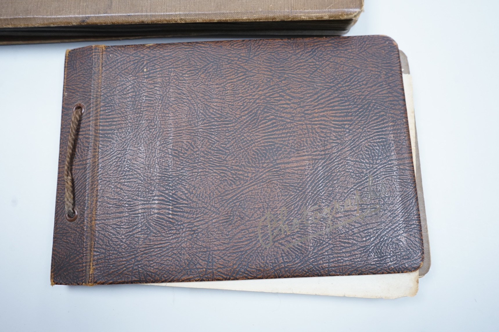 Two WWII naval photo albums, containing an archive of 1940s photographs of the Russian convoy in the Barents Sea, a ship’s concert at Scarpa Flow, a variety of Royal Naval vessels and some aircraft, images aboard HMS Peg